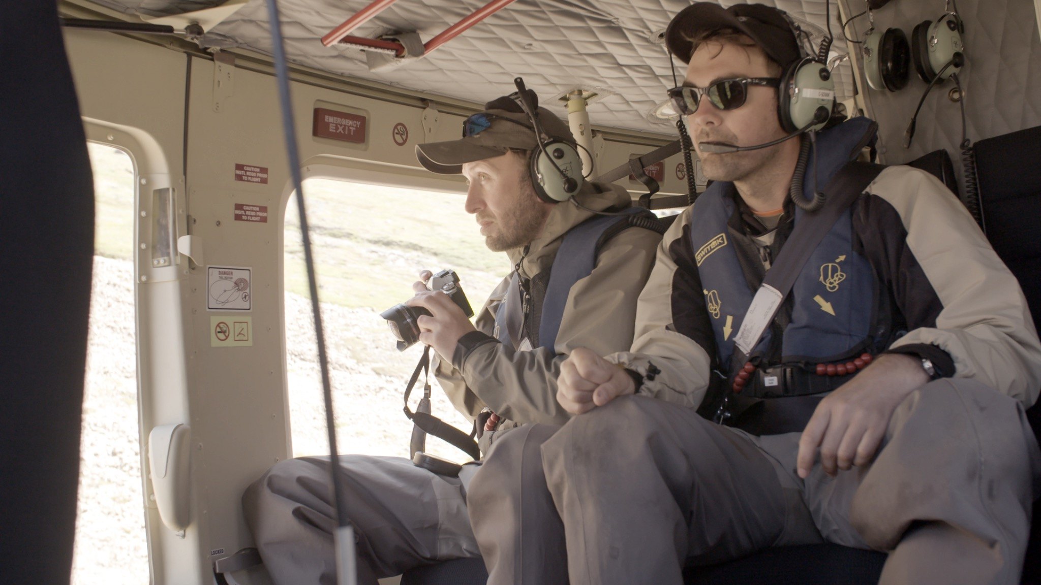 Researchers travelling by helicopter during remote fieldwork