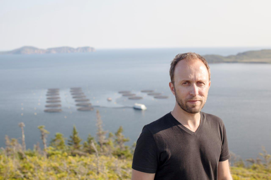 Ian Bradbury overlooking a coastal marine landscape